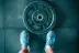 person standing beside black weights